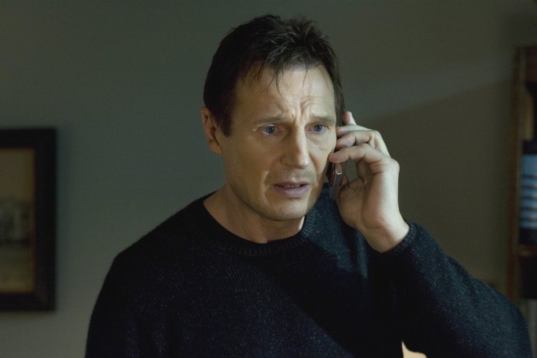 A man on the phone, mid-threat